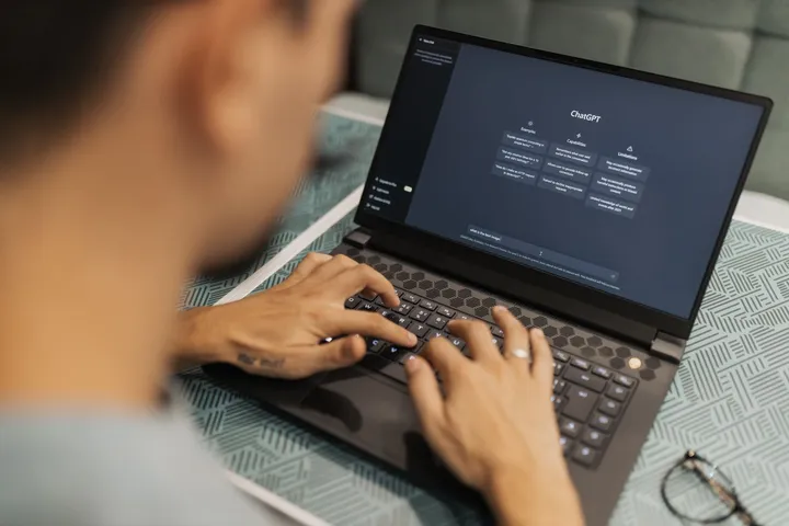 A developer connecting software systems through an API on screen — Avaib AI integration