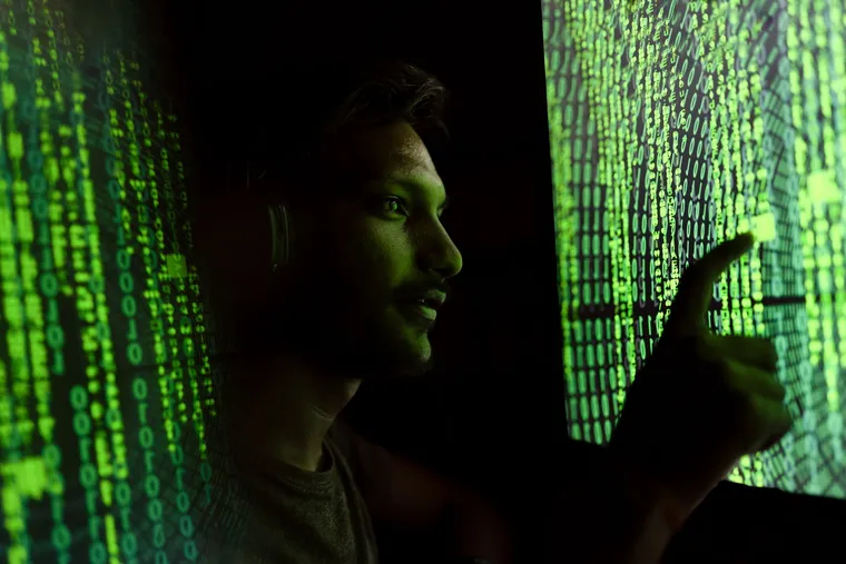 A security and governance professional working at a computer — Avaib