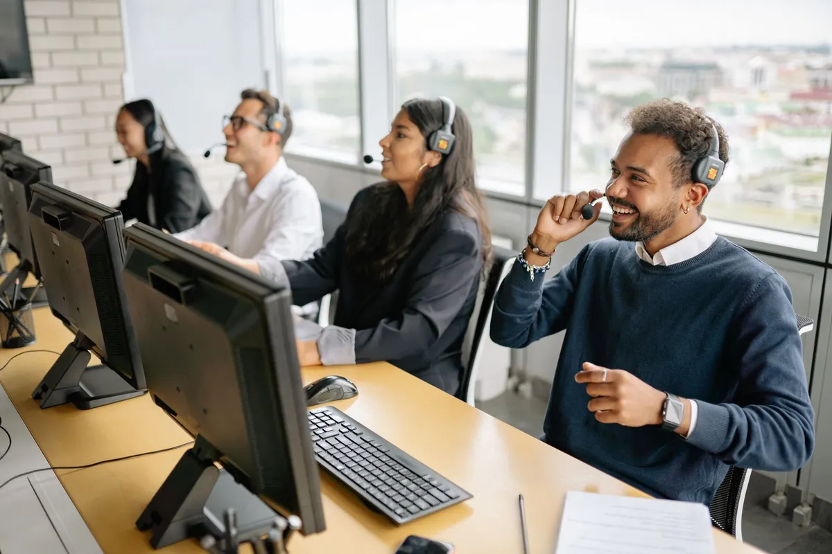 A busy customer service team in an open-plan office