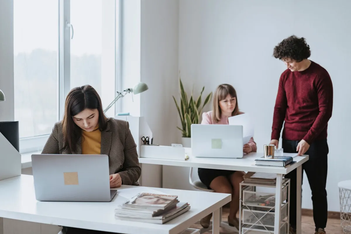 A modern technology team working in a bright office