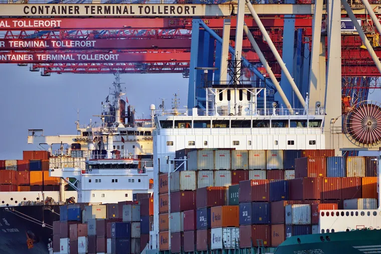 Shipping containers stacked at a cargo port — Avaib