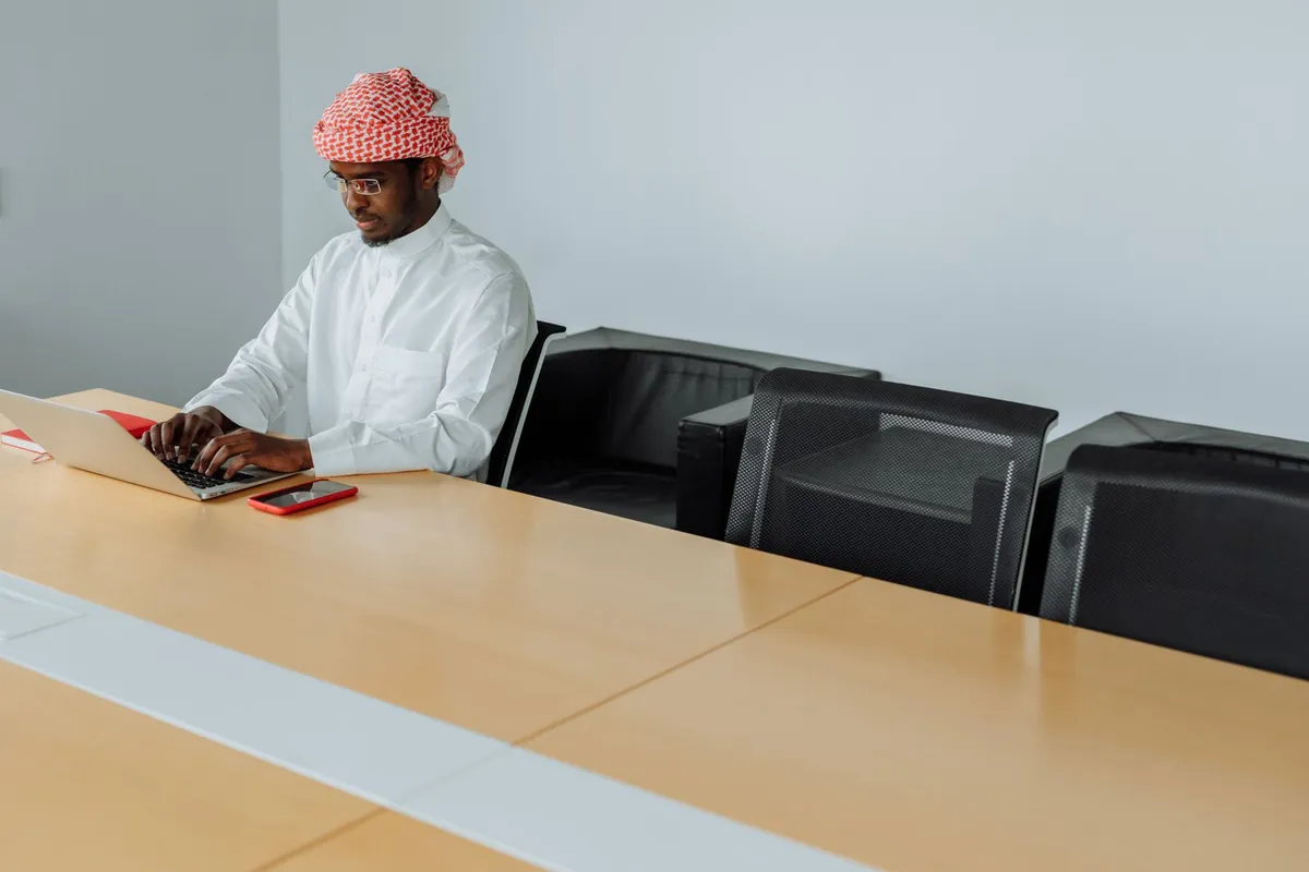 Middle East professionals meeting over technology in a modern office