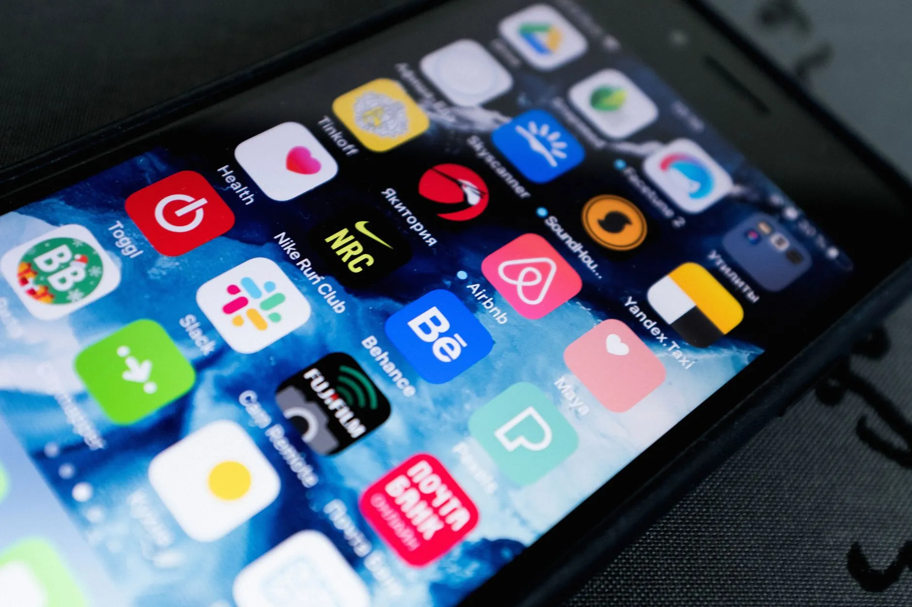 A developer testing a native iOS and Android app on a smartphone — Avaib