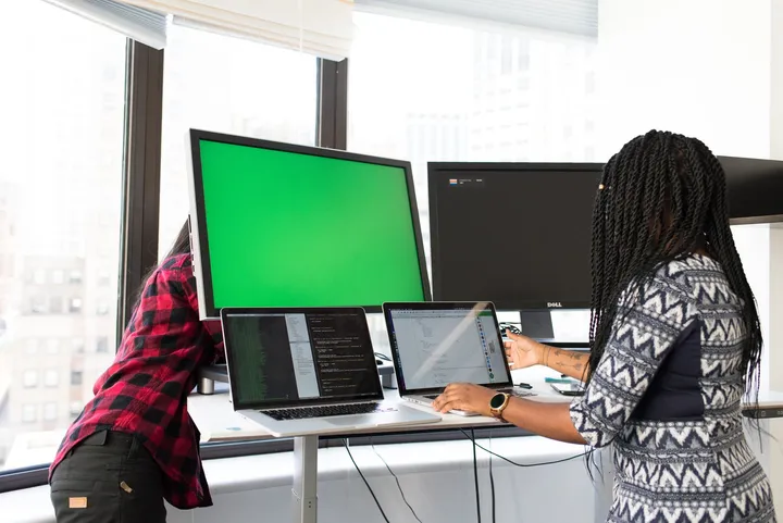 Two senior software engineers building a product together at one screen — Avaib