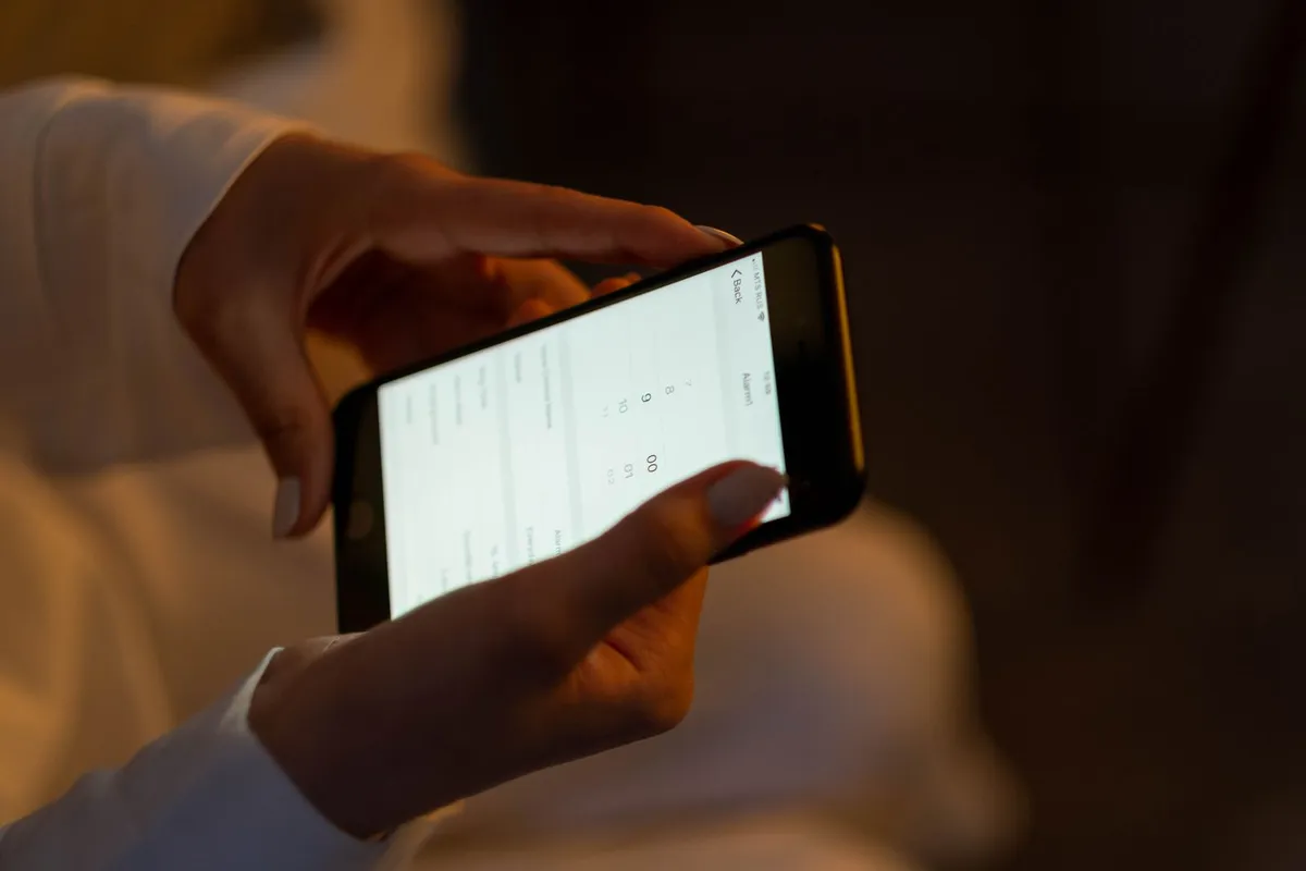 A person using a mobile app on their smartphone