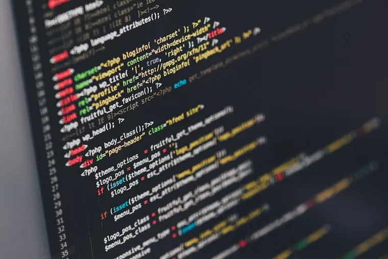 A developer writing custom software code on screen