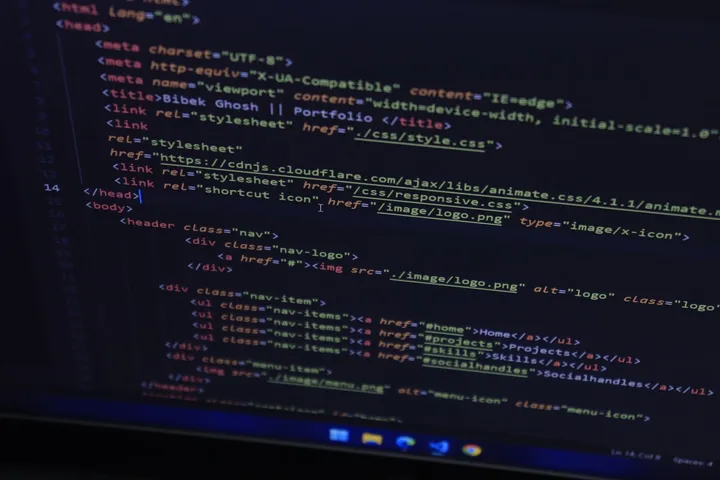 A JavaScript developer writing code in the editor — full-stack JavaScript at Avaib — Avaib