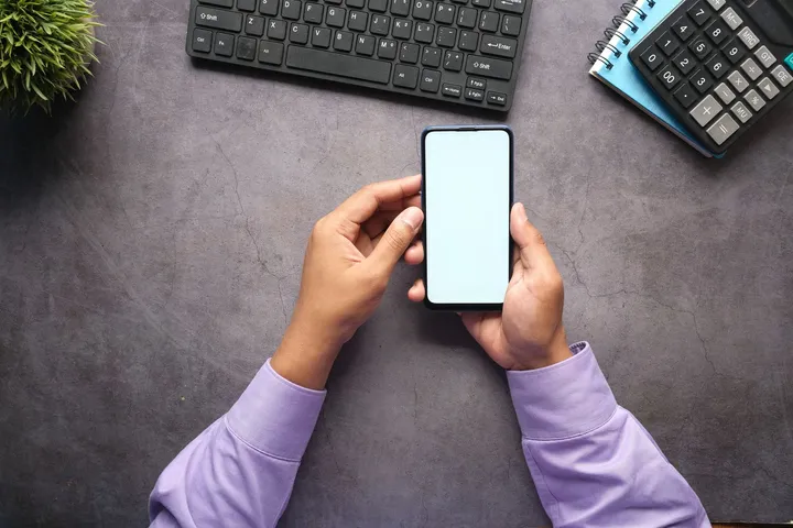 A mobile team testing an app on real phones in the office