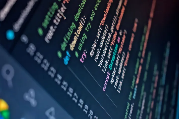 A Python developer working through code and data on screen — Python development at Avaib — Avaib