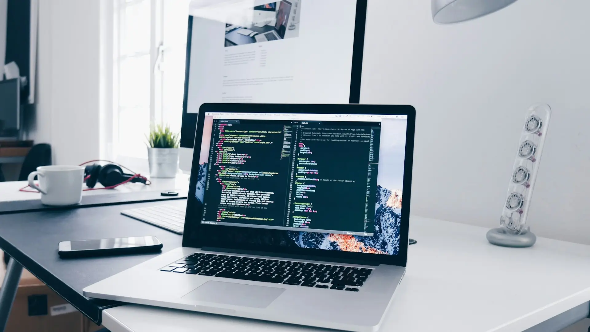 Developer writing code on a laptop — Avaib custom software development
