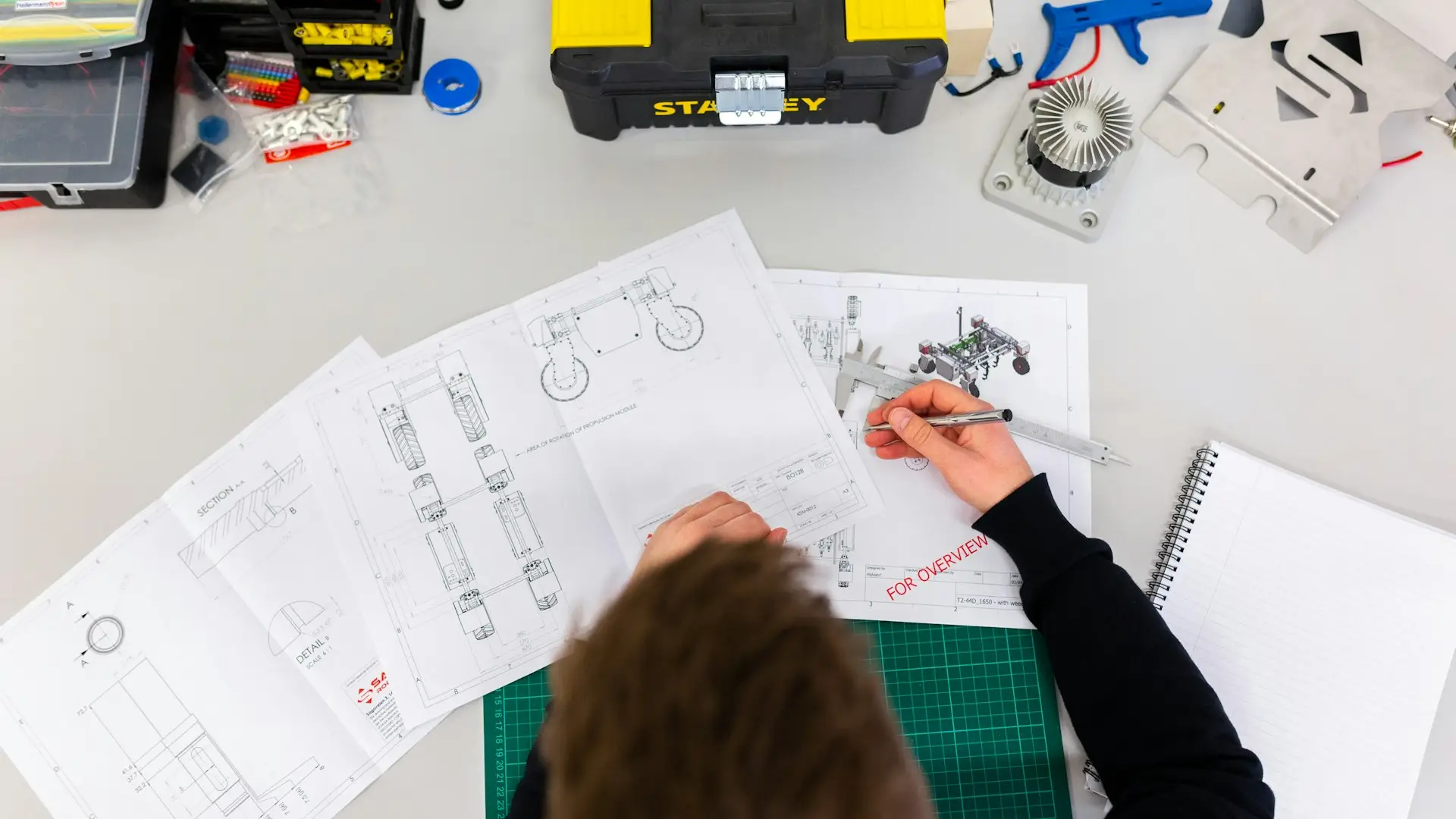 An engineer maintaining software at a workstation — Avaib software maintenance