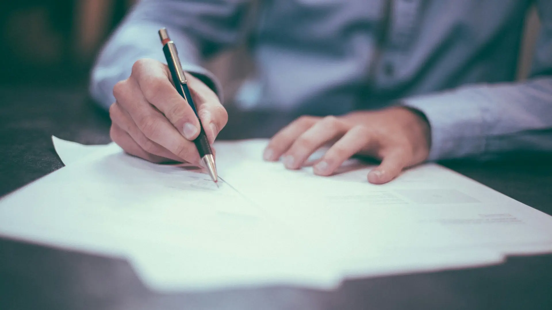 A signed agreement on a desk — Avaib terms of service